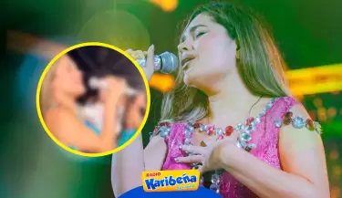 Lesly guila canta en concierto cargando a un beb