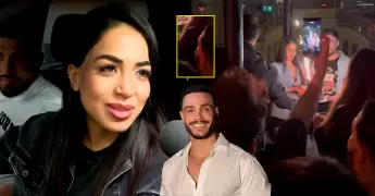Onelia Molina y Mario Irivarren ampayados abrazándose